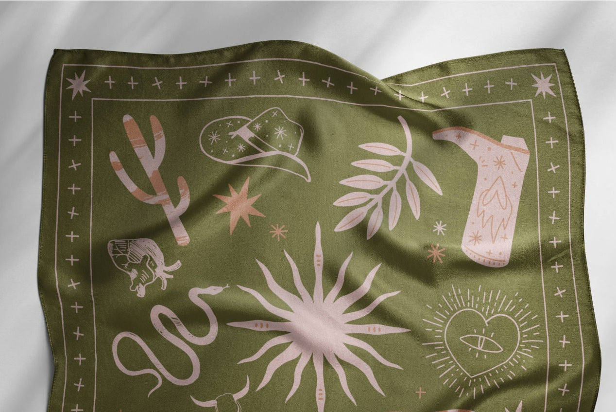 Green bandana with pink desert-themed designs on a white background